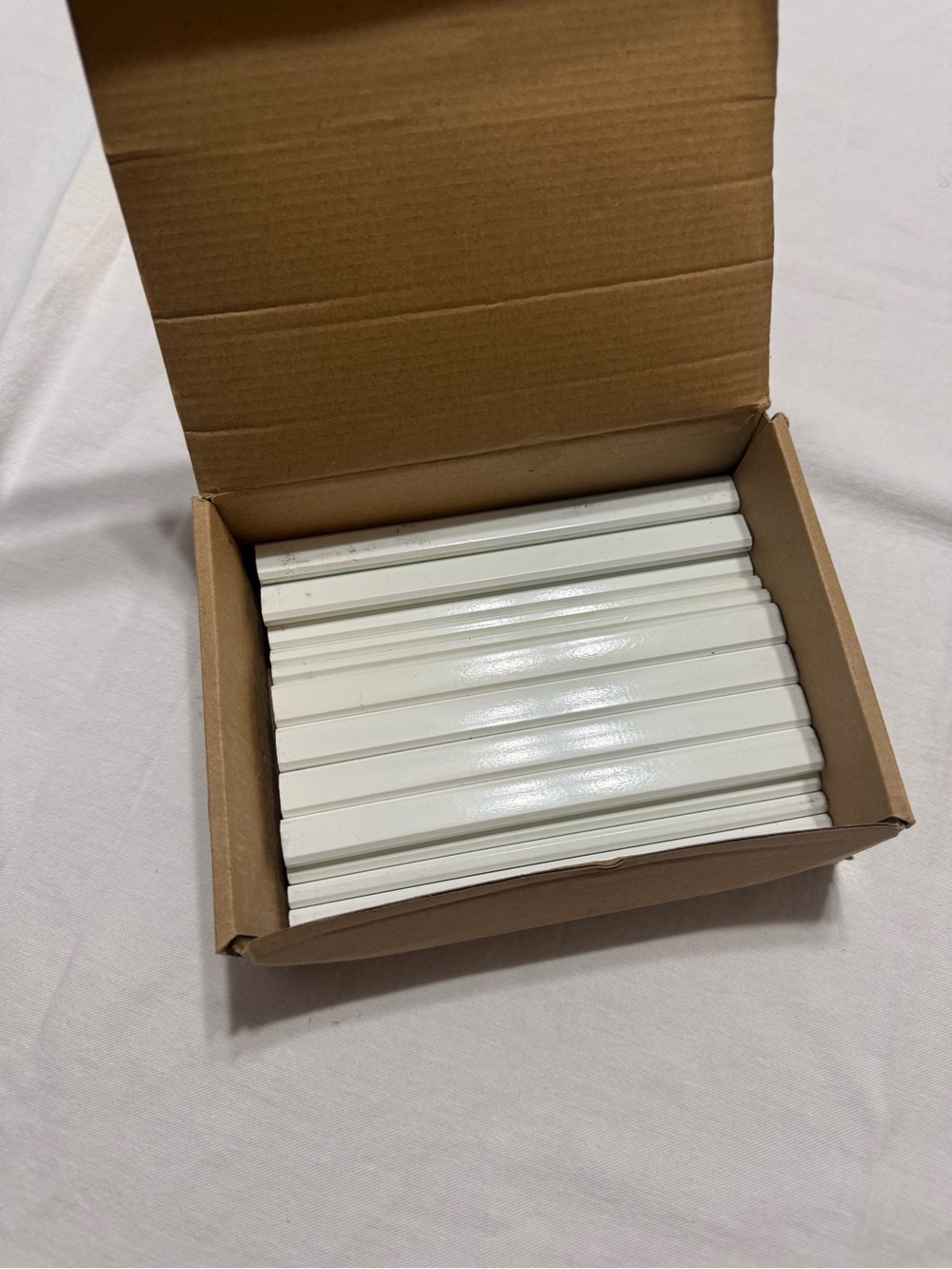 Box of white unsharpened carpenter pencils